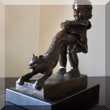A18. Bronze of girl dragging an unwilling cat signed Juan Clara. Marble base. 9.5”h 
